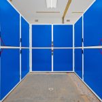 Blue storage cabinets in a warehouse.