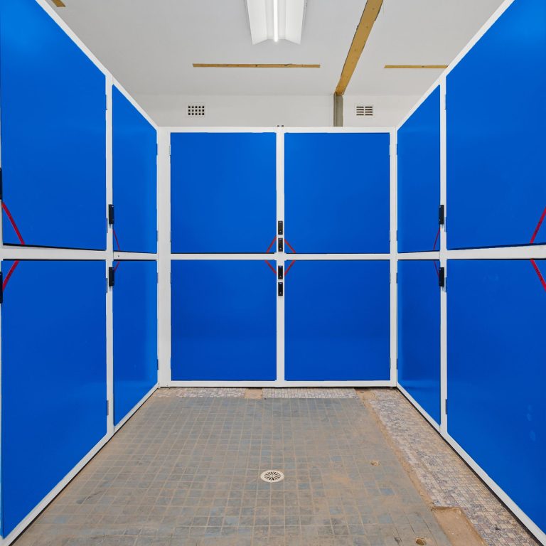 Blue storage cabinets in a warehouse.