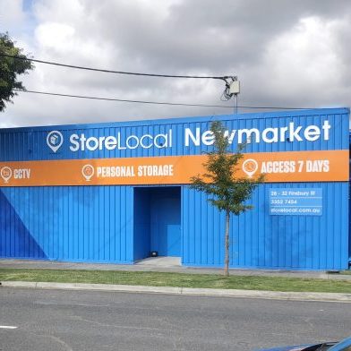 http://A%20blue%20building%20with%20a%20sign%20that%20says%20store%20local%20newmarket.