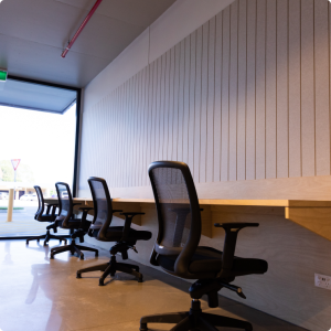 An office with a desk and chairs.