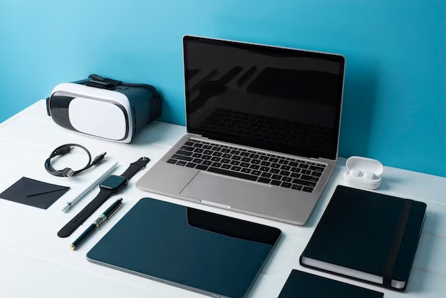 electronic devices lined up on desk